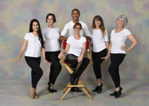 A group of adult dancers wearing tap shoes