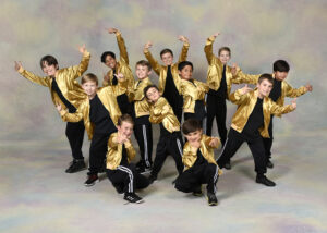 A group of boy dancers doing a hip hop pose